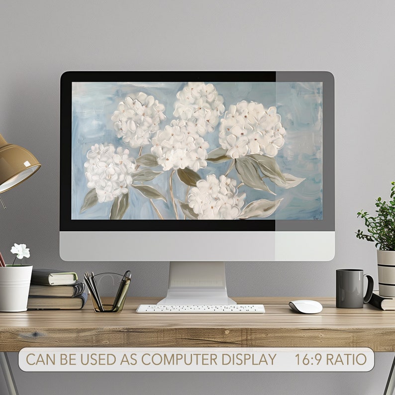 May include: A digital illustration of white hydrangeas on a blue background. The image is displayed on a computer monitor.