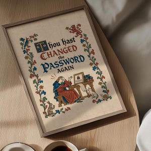 May include: A framed print featuring medieval-style illumination with the text "Thou hast CHANGED the PASSWORD AGAIN." The illustration depicts a person in a red robe sitting at a desk with a computer screen showing a lock icon, a cat, and a rabbit.