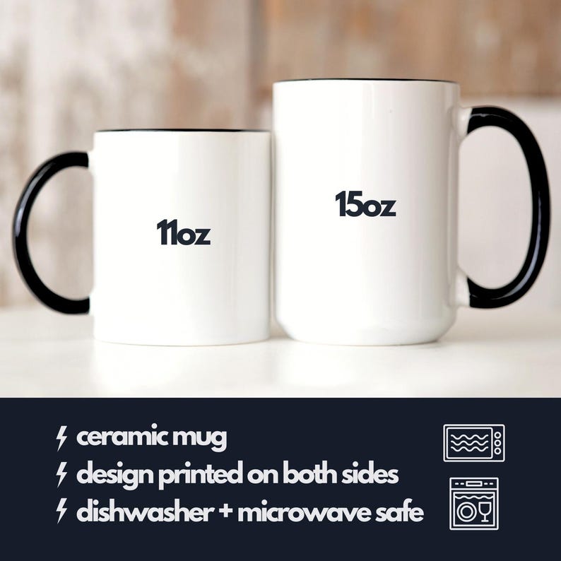 May include: Two white ceramic mugs with black handles and black trim. The smaller mug is 11 oz and the larger mug is 15 oz. Both mugs are dishwasher and microwave safe.
