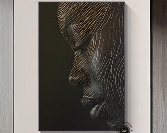 May include: Abstract art print featuring a black and gold portrait of a person's face. The face is stylized with lines and patterns.