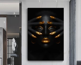 May include: A black and gold portrait of a person with their hands covering their face. The person's eyes, lips, and fingernails are painted gold.