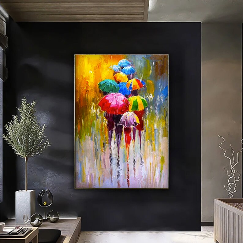 May include: A colorful painting of people walking in the rain with umbrellas. The umbrellas are red, yellow, green, blue, and purple. The background is a blurred yellow and green.