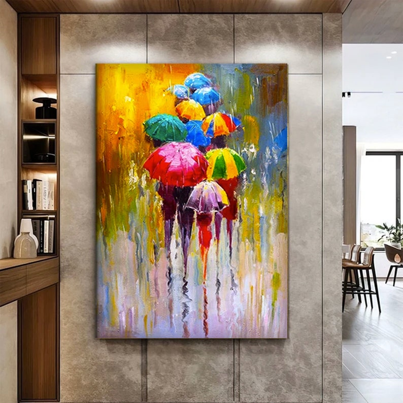 May include: A colorful abstract painting of people walking with umbrellas in the rain. The painting features a variety of colors, including red, yellow, blue, green, and purple. The umbrellas are all different shapes and sizes, and the people are walking in a variety of directions. The painting is set against a background of a yellow sky and a gray street.