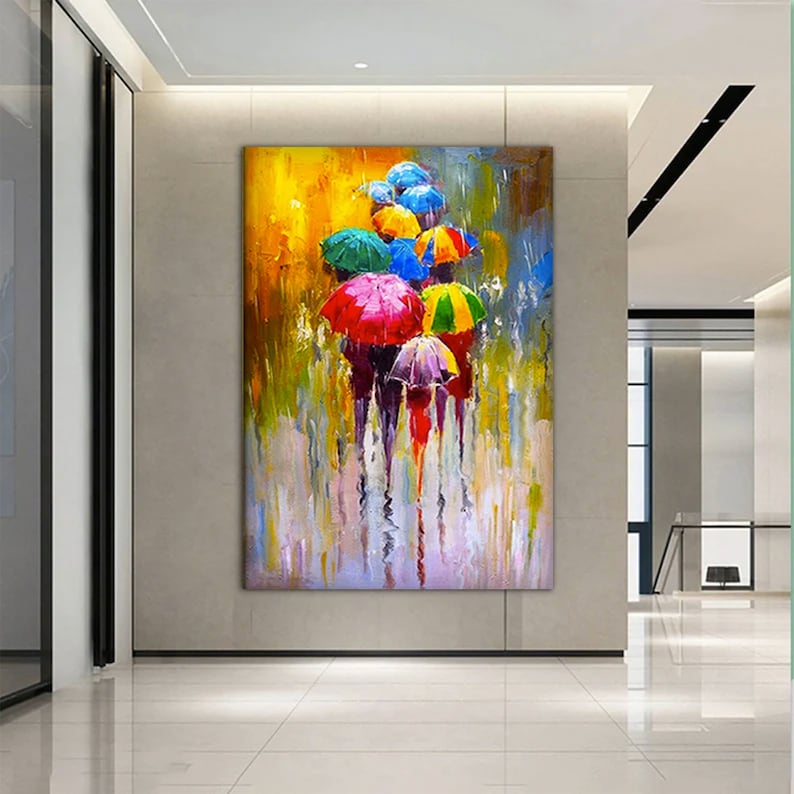 May include: A colorful abstract painting of people walking under umbrellas in the rain. The umbrellas are various shades of red, yellow, blue, green, and purple. The background is a blurred yellow and blue.