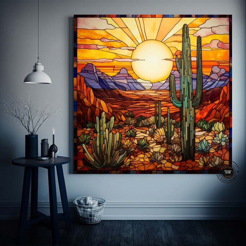May include: A stained glass artwork depicting a desert landscape with a large sun setting behind a tall cactus and smaller cacti in the foreground. The colors are vibrant and include shades of orange, yellow, red, green, and blue.