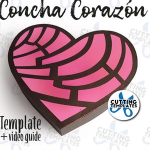 Könnte beinhalten: Eine herzförmige Schablone in Rosa und Braun für eine Concha, ein traditionelles mexikanisches süßes Brot. Die Schablone ist mit "Concha Corazón" beschriftet und enthält den Text "Vorlage + Videoanleitung".