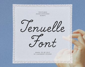 May include: A square white fabric piece with a lace border featuring the black embroidered text "TEXTURED HAND-STITCHED SCRIPT", "Tenuelle Font", and "MADE TO BE FELT BY GAFAROFF STUDIO" in a cursive style, presented on a solid blue background.