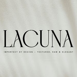 May include: The word "LACUNA" in a bold, elegant serif font, with the tagline "IMPERFECT BY DESIGN - TEXTURED, RAW & ELEGANT" below. The text is black against a textured, off-white background with soft shadows.