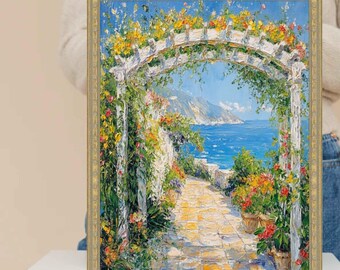 Può includere: Dipinto incorniciato raffigurante una scena costiera con un arco di pergolato bianco adornato da fiori colorati. Un sentiero in pietra conduce al mare, con piante in vaso lungo il percorso. L'opera d'arte ha una cornice dorata e uno stile impressionista vibrante.
