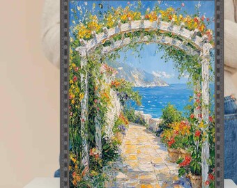 Può includere: Dipinto incorniciato raffigurante una scena costiera con un arco bianco ornato di fiori gialli e rosa. Un sentiero in pietra conduce al mare sotto un cielo azzurro. Fiori in vaso costeggiano il sentiero, aggiungendo colore all'opera.