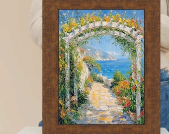 Può includere: Dipinto incorniciato raffigurante una scena costiera con un arco bianco ornato di fiori gialli e verdi. Un sentiero di pietra conduce al mare sotto un cielo blu. La cornice è di colore marrone scuro.