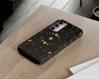 May include: Black phone case with a gold celestial design featuring a circle of moons and stars.
