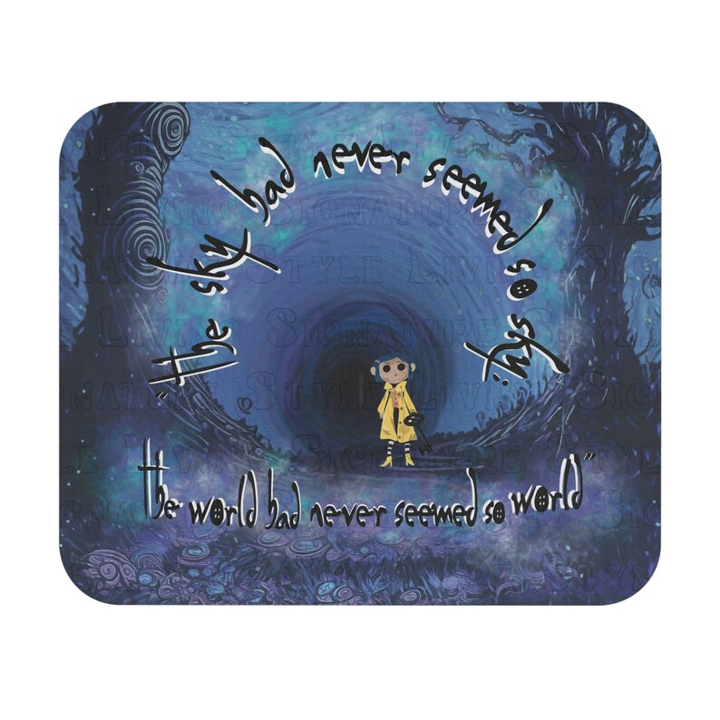 May include: A mouse mat with a design from the film "Coraline." The image depicts a character in a yellow coat in a dark tunnel, with the quote "The sky had never seemed so sky. The world had never seemed so world." in white script.