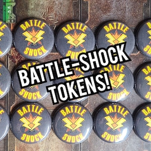 May include: A set of 12 round, gray, button-shaped tokens with a yellow lightning bolt graphic and the text "BATTLE-SHOCK".
