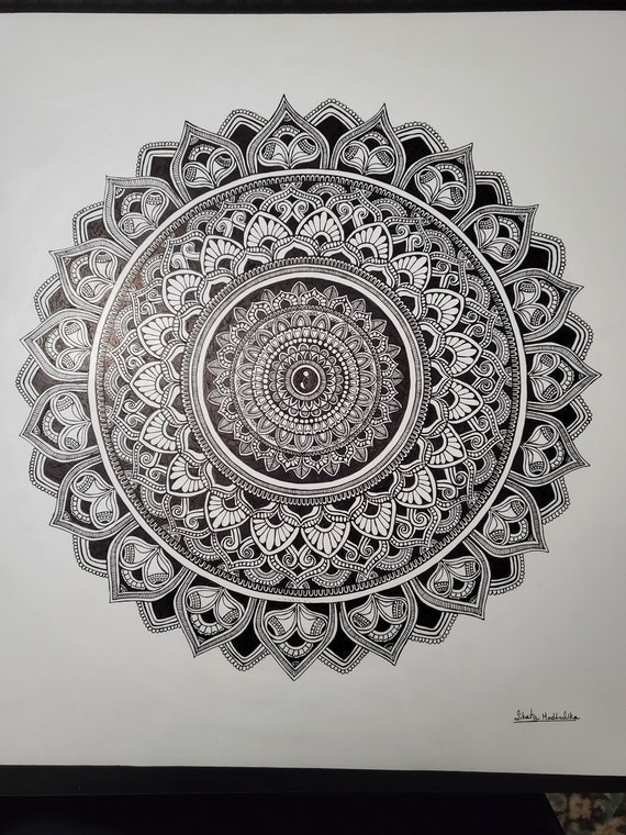 Mandala art with geometric circle traditional hand made art work. The art represents peace unity spirituality and it helps in meditation