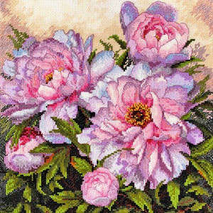 May include: A close-up of a bouquet of pink peonies with green leaves. The peonies are in various stages of bloom, with some fully open and others still in bud.