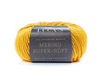 May include: A skein of yellow superfine merino wool yarn. The label reads "LUGA-S EST 1992 100% SUPERFINE MERINO MERINO SUPER-SOFT QUALITY FOR EVERYONE".