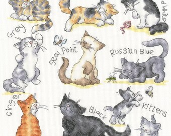 May include: A cross-stitch pattern featuring nine different cat breeds, including Tabby, Tortoiseshell, Black and White, Grey, Seal Point, Russian Blue, Ginger, Black, and kittens. Each cat is depicted in a unique pose, with text labels identifying each breed.