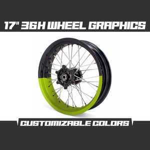 May include: 17" 36H wheel graphics featuring a black and green colour scheme. The wheel is a spoke wheel with a black rim and a green rim band. The graphics are customisable.