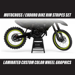 May include: A black and gray motocross bike with neon yellow rim stripes. The image includes the text "MOTOCROSS / ENDURO BIKE RIM STRIPES SET" and "LAMINATED CUSTOM COLOR WHEEL GRAPHICS". The bike is on a black stand.