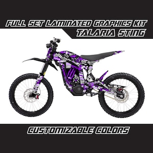 May include: Full set laminated graphics kit for a Talaria Sting electric dirt bike. The graphics feature a purple and black colour scheme with a graffiti-style design. Customizable colours are available.