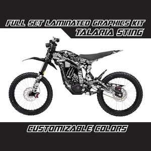 May include: Full set of laminated graphics for a Talaria Sting electric dirt bike. The graphics feature a black and white design with a variety of text and graphics. Customizable colours are available.