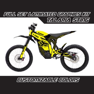 May include: A yellow and black electric dirt bike with custom graphics. The bike has a black seat, black wheels, and a black frame. The graphics are a mix of black, yellow, and white. The bike has a Fox Racing logo on the side. The text "FULL SET LAMINATED GRAPHICS KIT TALARIA STING" is at the top of the image. The text "CUSTOMIZABLE COLORS" is at the bottom of the image.