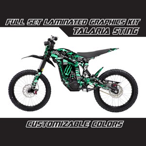 May include: Full set of laminated graphics for a Talaria Sting electric dirt bike. The graphics feature a black and green colour scheme with a variety of graphic elements, including a Monster Energy logo, a skull, and the words "Rock Shop".