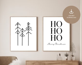 Puede incluir: Dos impresiones artísticas enmarcadas con diseños navideños minimalistas. Una presenta ilustraciones de árboles negros, la otra dice "HO HO HO" con "Merry Christmas" en escritura. Ambas están en marcos de madera sencillos, ideales para la decoración navideña.