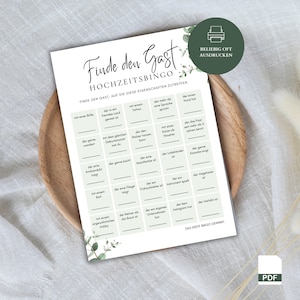 May include: A printable wedding game bingo card with the title "Finde den Gast" (Find the Guest) and the instructions "Find the guest who matches these characteristics". The card has a green and white colour scheme with a floral design.