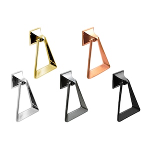 May include: Five triangular-shaped towel rings in different finishes: gold, copper, silver, black, and nickel. Each ring is mounted to a square base.