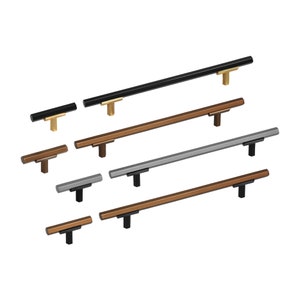 May include: Assortment of cabinet hardware pulls in various finishes, including black, bronze, and silver. The pulls are all rectangular in shape and have a simple, modern design.