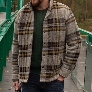 Mens warm jacket for fall and spring. The jacket is sewn from a wool house fabric with a plaid pattern. The wool jacket is very comfortable and classic cut. The jacket is very warm and keeps the wind out.