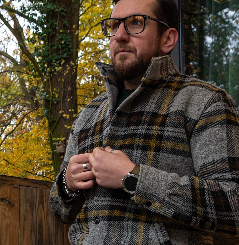 Mens warm jacket for fall and spring. The jacket is sewn from a wool house fabric with a plaid pattern. The wool jacket is very comfortable and classic cut. The jacket is very warm and keeps the wind out.