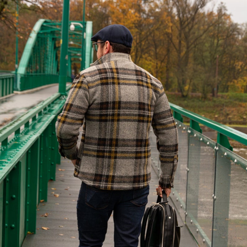 Mens warm jacket for fall and spring. The jacket is sewn from a wool house fabric with a plaid pattern. The wool jacket is very comfortable and classic cut. Jacket in the English style, the style of old monay.