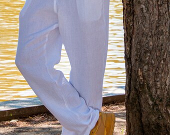 May include: White lightweight pants with a relaxed fit. The pants have a drawstring waistband and are made of a soft, breathable fabric.