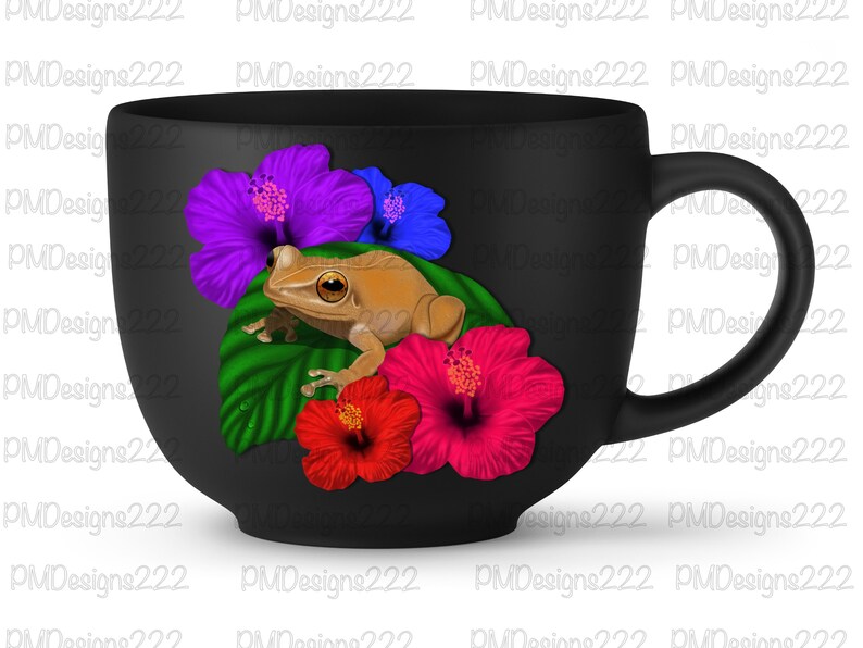 May include: A black ceramic mug with a handle features a brown frog sitting on a green leaf with pink, purple, and blue hibiscus flowers.