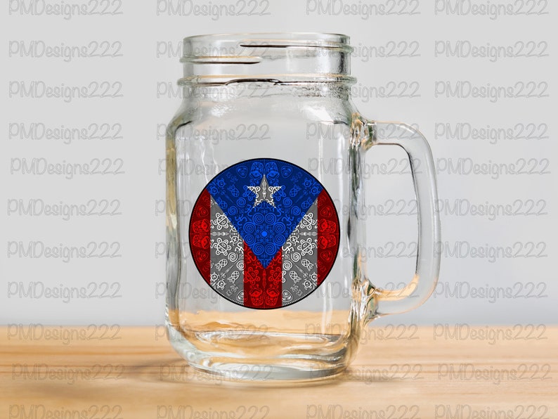 May include: A clear glass mason jar mug with a handle. The mug has a round sticker on the front featuring the Puerto Rican flag with a white, blue, and red color scheme. The flag has a white star in the blue triangle.