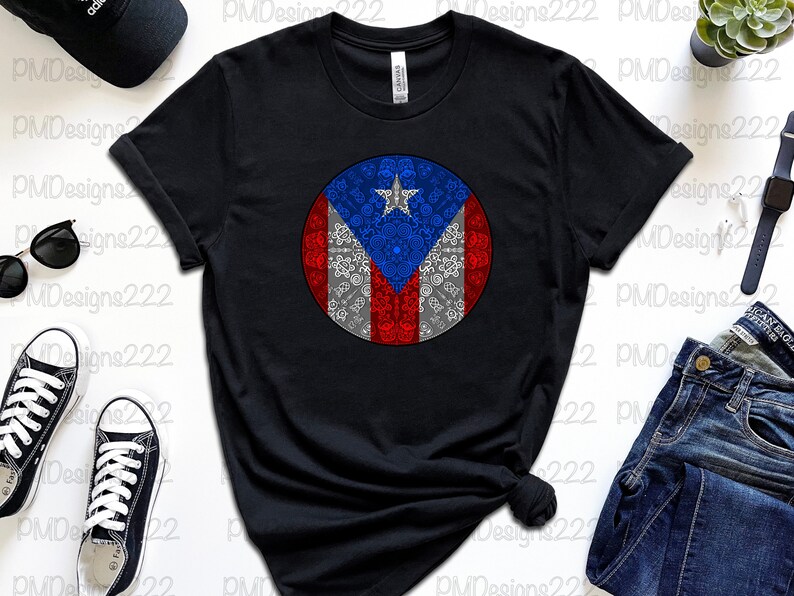 May include: Black t-shirt with a white circle design featuring the Puerto Rican flag. The flag is red, white, and blue with a star in the upper left corner. The circle design is surrounded by a white border.