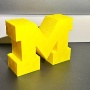 Michigan (M) Plastic Yellow Logo for College Bed Party Or Dorm Room - 3D Printed