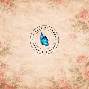 May include: Vintage-style background with a floral pattern of pink roses and green leaves. A circular logo in the center features a blue butterfly and the text "LE COSE DI LAURA SCRAP & VINTAGE". The overall design has a faded, aged appearance.