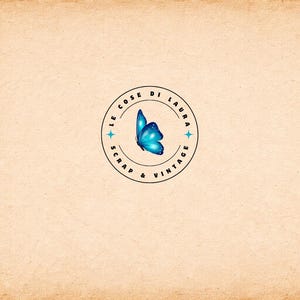 May include: A logo featuring a blue butterfly inside a circular design with the text "LE COSE DI LAURA SCRAP & VINTAGE" in a black font. The logo is set against a beige, textured background.