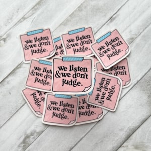 May include: A stack of pink sticky notes with the text "We listen & we don't judge." repeated on each note.