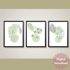 Peut inclure: Ensemble de trois impressions d'art mural imprimables mettant en scène des dessins minimalistes de feuilles et de fleurs en gris sur un fond blanc avec des cercles verts.
