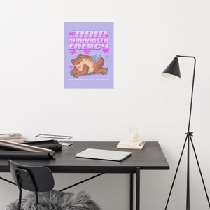 May include: A purple poster with the text "Main Character Energy" in pink letters. A cartoon frog with a blue butterfly on its back is sitting on a green patch of grass. Pink butterflies are flying around the frog.