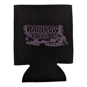 May include: Black beverage insulator with the text "Rainbow Rabble" in purple. The design includes a banjo and other whimsical illustrations. The insulator is made of a textured material and is designed to keep drinks cold.