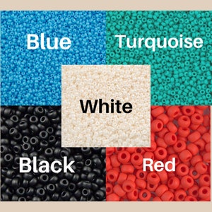 May include: Assortment of colorful seed beads in blue, turquoise, white, black, and red.