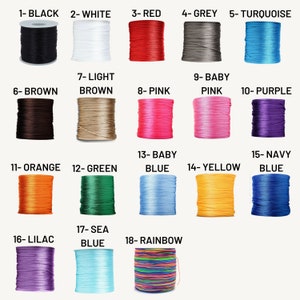 May include: A collection of 18 spools of waxed cotton cord in various colors, including black, white, red, grey, turquoise, brown, light brown, pink, baby pink, purple, orange, green, baby blue, yellow, navy blue, lilac, sea blue, and rainbow.