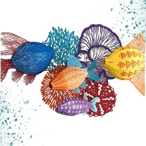 May include: Five colorful paper fish and coral reef decorations. The fish are blue, orange, yellow, purple, and red. The coral reef is blue and green.