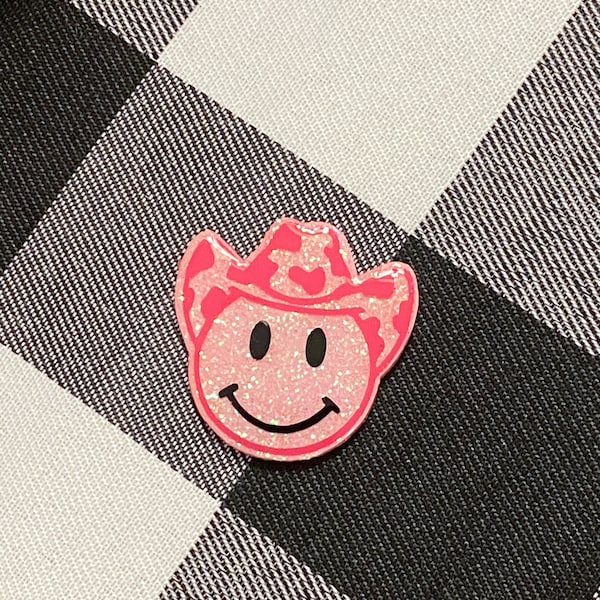 Bobine d'insigne de cow-boy scintillant et souriant